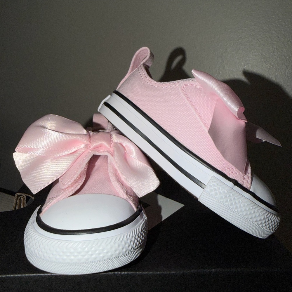 PINK FROSTING CONVERSES WITH BOW STRAP